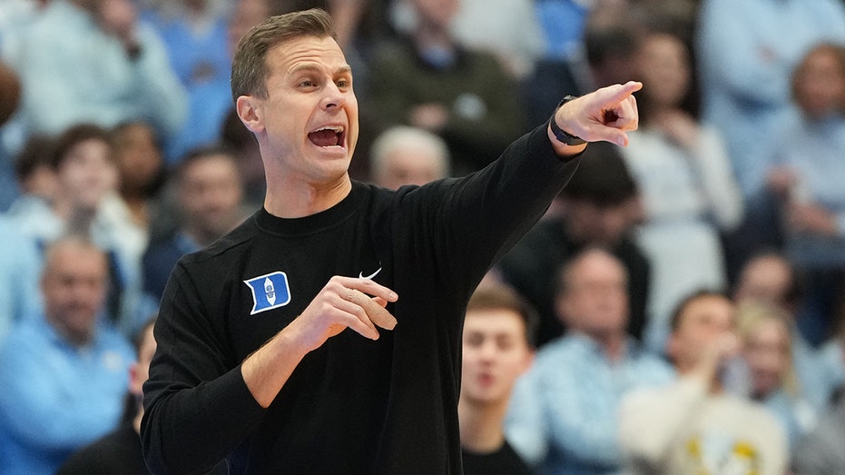 Duke staffers 'got punched in the face' as UNC fans stormed court after upset win, coach says