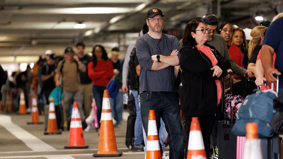 Shutdown sparks flight chaos as TSA lines spill into parking lots with 3-hour waits or longer